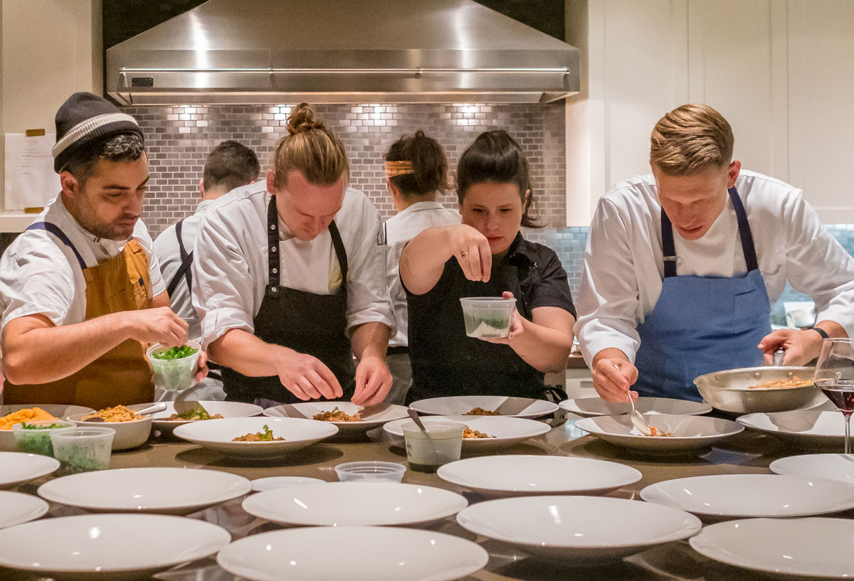 Top chefs plating dinners