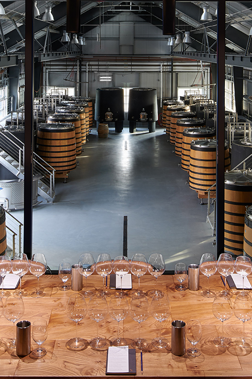 A table overlooking the production facility at Kosta Browne Winery in Sebastopol, CA.